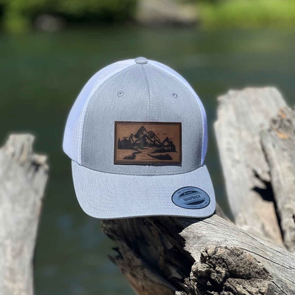 Brand New Gray and White Tucker Hat.